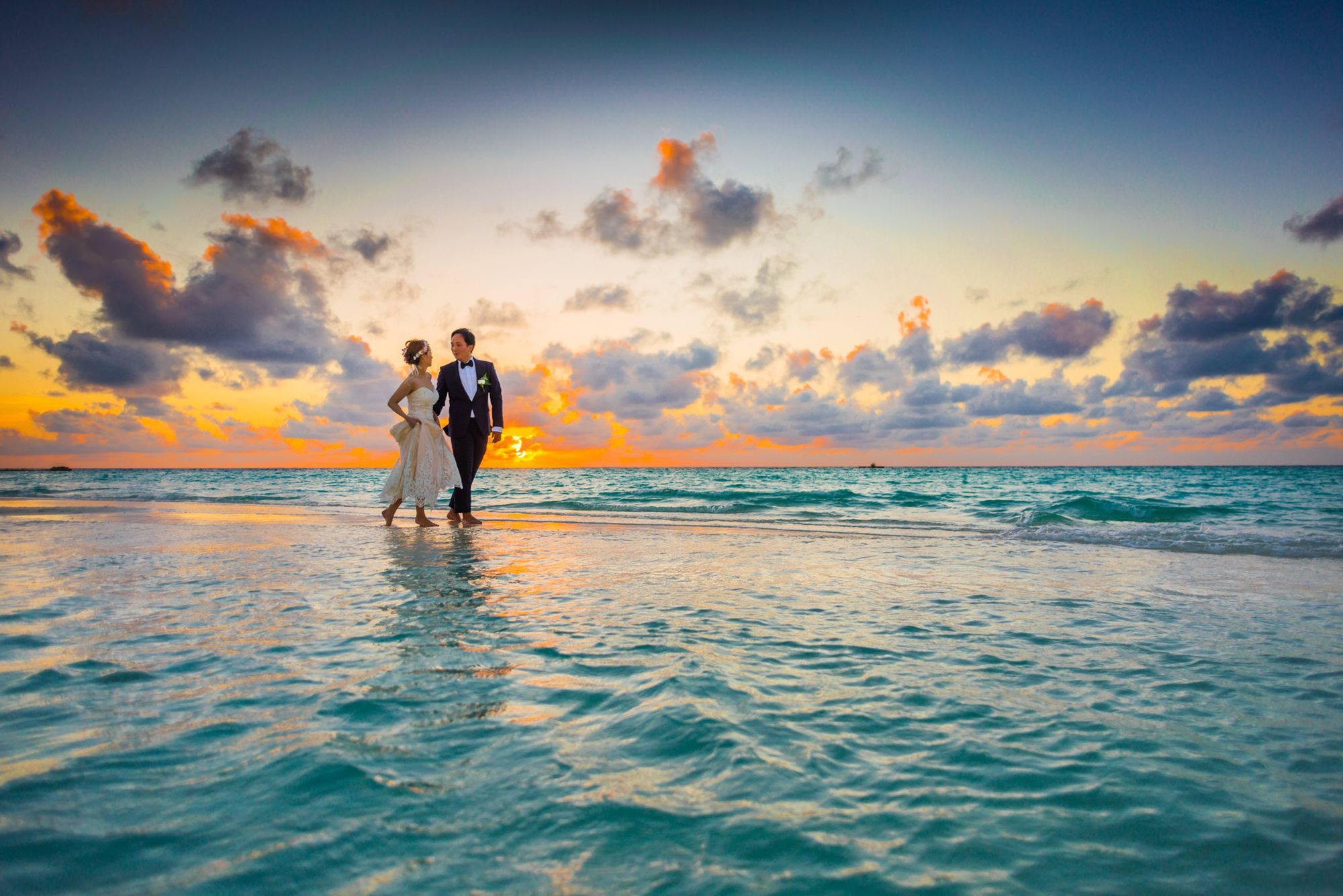 A couple sharing a warm moment at sunset